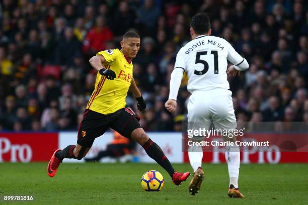 Jerome Sinclair of Watford and Roque Mesa of Swansea City in action during the Premier League match between Watford and Swansea City at Vicarage Road...