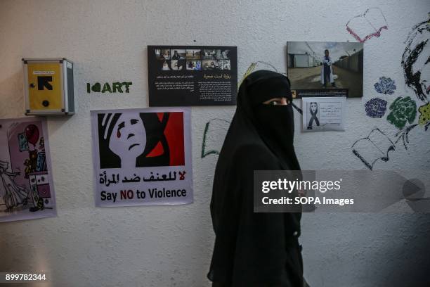 Syrian refugees walks through a women's centre run by the International Rescue Committee in Mafraq, close to the Syrian-Jordan border. The centre...