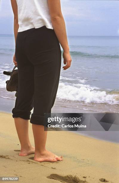 Woman in front of the sea. Guardamar del Segura. Alicante.