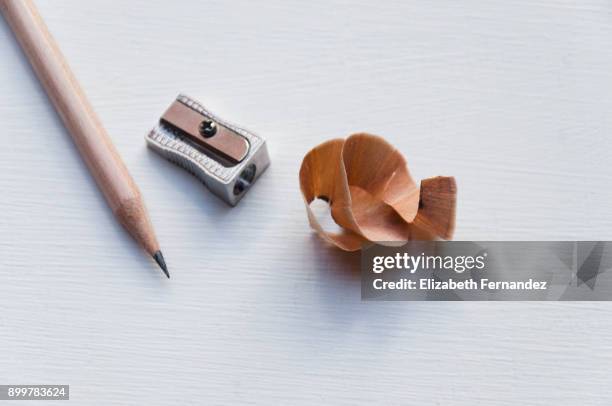 pencil and sharpener with shavings - pencil sharpener stockfoto's en -beelden