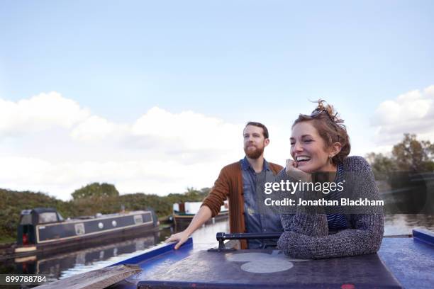 couple on canal boat - barge fotografías e imágenes de stock