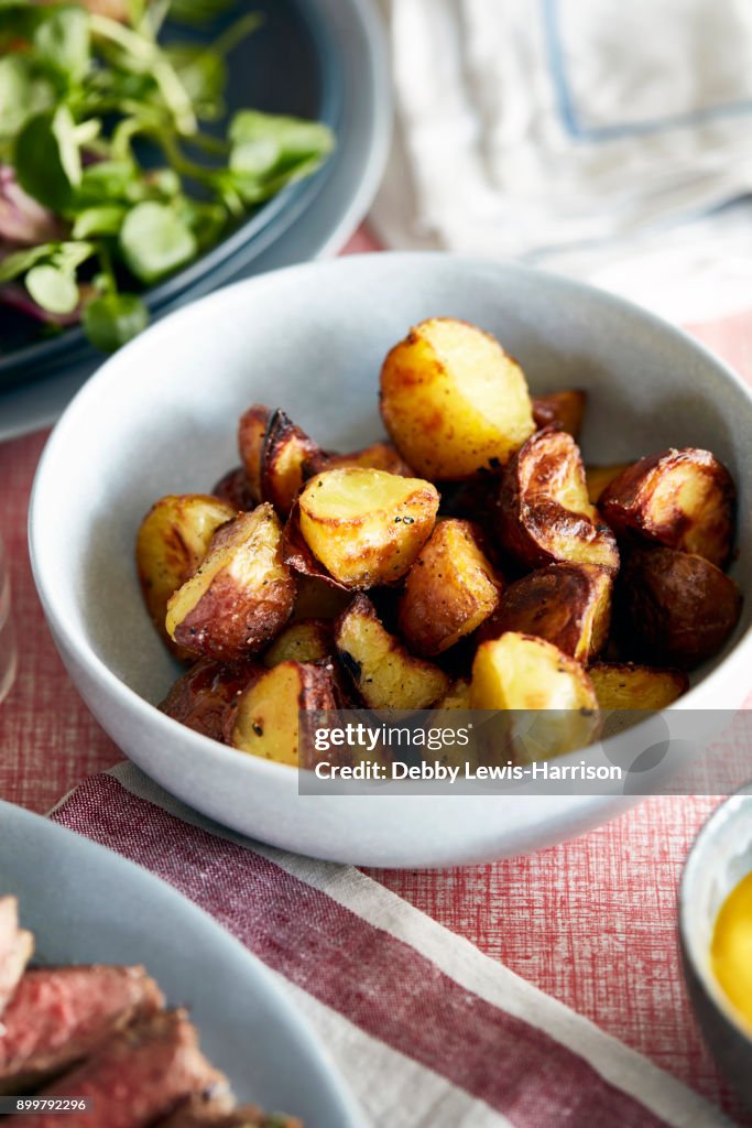 Roast potatoes in bowl, close-up