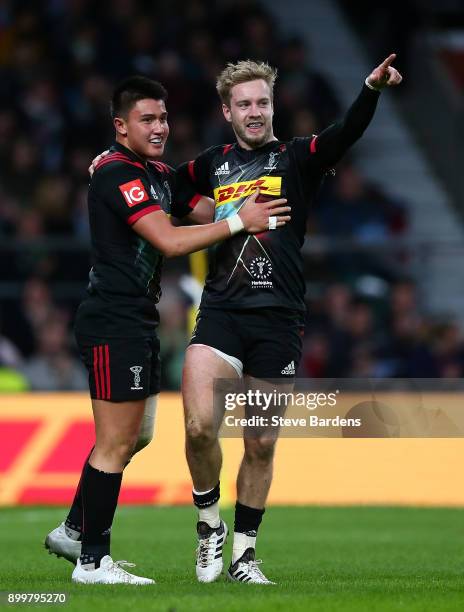 Charlie Walker of Harlequins celebrates with team mate Marcus Smith after scoring his team's second try of the game during the Aviva Premiership Big...