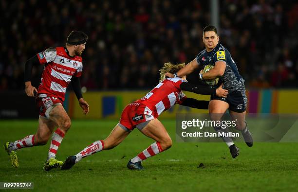 Rohan Janse van Rensburgh of Sale Sharks is tackled by Billy Twelvetrees of Gloucester during the Aviva Premiership match between Gloucester Rugby...