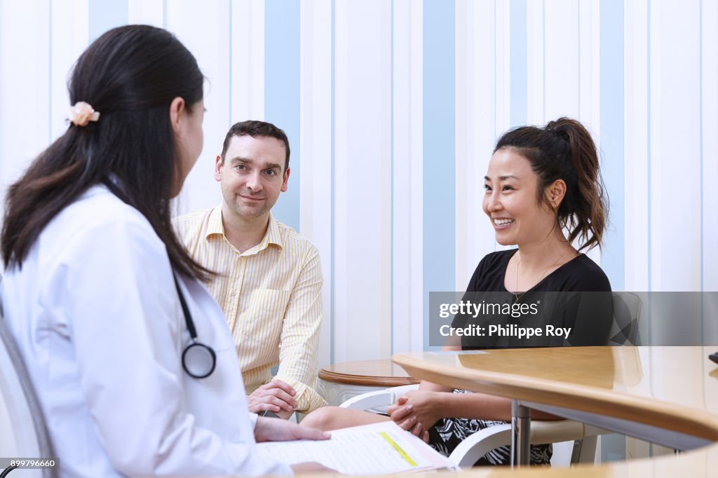 Doctor consulting with patients