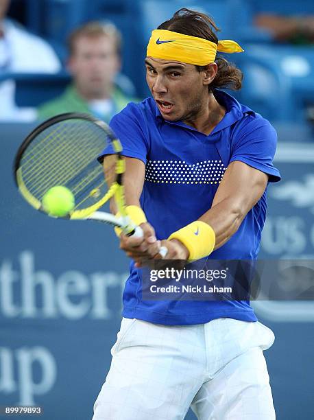 Rafael Nadal of Spain hits a backhand against Paul-Henri Mathieu of France during day four of the Western & Southern Financial Group Masters on...