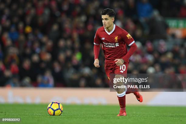 Liverpool's Brazilian midfielder Philippe Coutinho controls the ball during the English Premier League football match between Liverpool and Leicester...