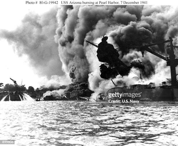 The USS Arizona burns during the bombing of Pearl Harbor, December 7, 1941 in Hawaii.