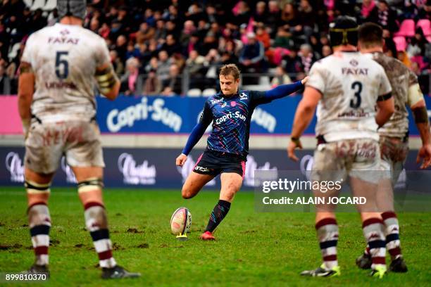 Stade Francais' French fly-half Jules Plisson kicks a penalty during the Top 14 rugby match between Stade Francais and Bordeaux-Begles at the Jean...