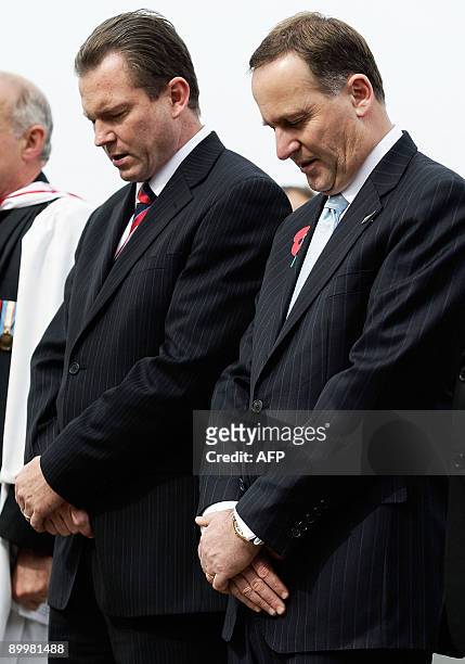 New Zealand Prime Minister John Key and and New South Wales Premier Nathan Rees stand for a minute of silence as they take part in a wreath laying...