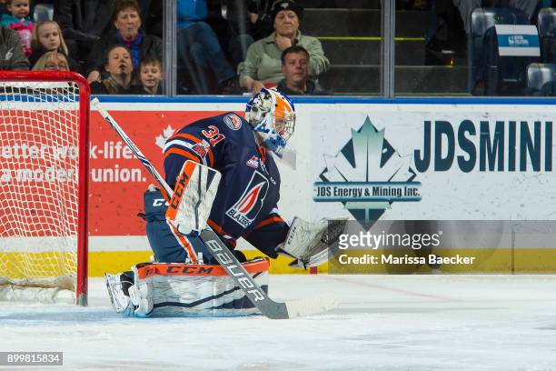 Dylan Ferguson of the Kamloops Blazers defends the net and makes a save against the Kelowna Rockets on December 27, 2017 at Prospera Place in...