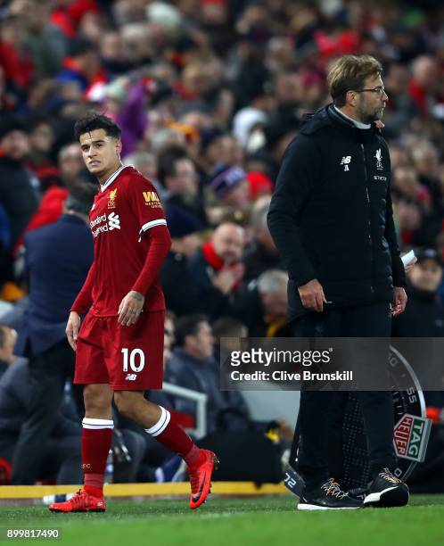 Philippe Coutinho of Liverpool leaves the pitch after being substituted off during the Premier League match between Liverpool and Leicester City at...