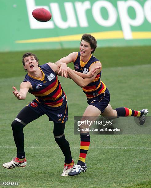 Kurt Tippett is tackled by Phil Davis during an Adelaide Crows AFL training session at AAMI stadium on August 21, 2009 in Adelaide, Australia.