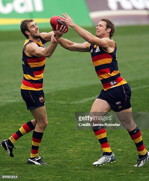 Scott Stevens and Ben Rutten fight for the ball during an Adelaide Crows AFL training session at AAMI stadium on August 21, 2009 in Adelaide,...