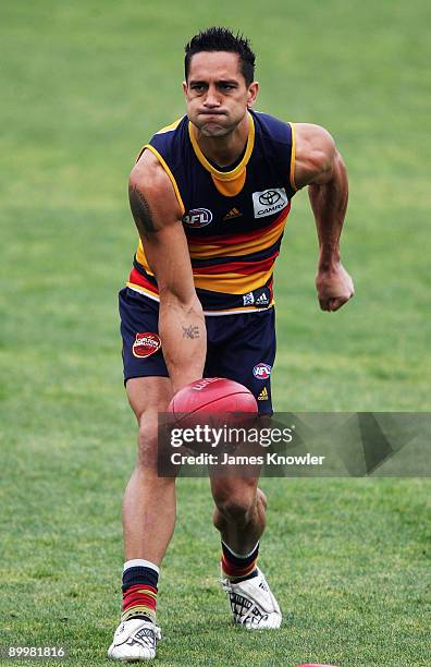 Andrew McLeod handballs during an Adelaide Crows AFL training session at AAMI stadium on August 21, 2009 in Adelaide, Australia.