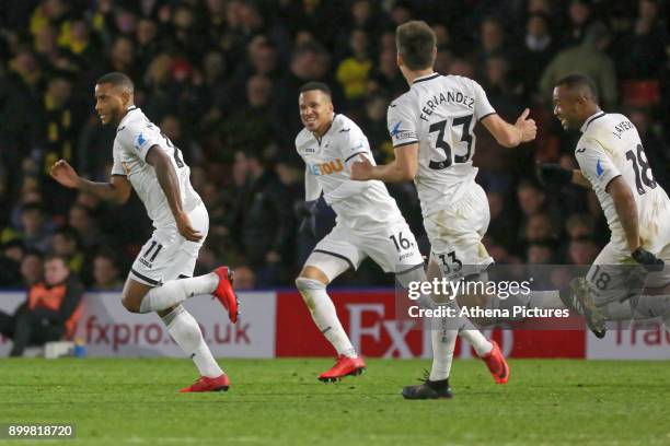 Luciano Narsingh of Swansea City celebrates his goal with team mates Martin Olsson, Federico Fernandez and co-scorer Jordan Ayew during the Premier...