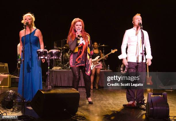 Cindy Wilsom, Kate Pierson and Fred Schneider of B-52'speforms at the DTE Energy Center on August 20, 2009 in Clarkston, Michigan.