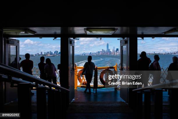 passengers travel on the staten island ferry in new york city - staten island ferry bildbanksfoton och bilder