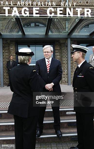 Australian Prime Minister Kevin Rudd speaks with Commander Christine Clarke and Rear Admiral Nigel Coates after arriving at the Heritage Centre at...