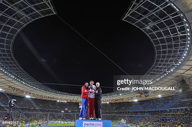 Russia's Anna Chicherova, Croatia's Blanka Vlasic and Germany's Ariane Friedrich celebrate during the medal ceremony of the women's high jump final...