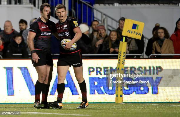 Owen Farrell and Brad Barritt of Saracens celebrate a try during the Aviva Premiership match between Saracens and Worcester Warriors at Allianz Park...