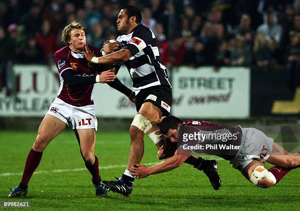 George Naoupu of Hawkes Bay is stopped by the Southland defence during the Air New Zealand Cup match between Southland and Hawke's Bay at Southland...