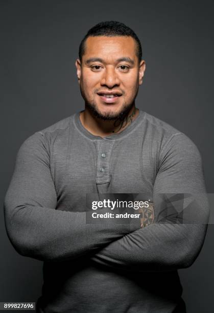 confident maori man in a studio - polynesian man stock pictures, royalty-free photos & images
