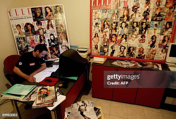 Lebanese journalist works at the publication's office in Awkar, north of Beirut, on August 13, 2009. France-based women's mags Elle and Marie-Claire,...