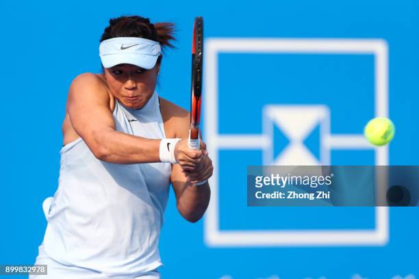 Xinyun Han of China returns a shot during the qualification match against Lesley Kerkhove of the Netherlands during 2018 WTA Shenzhen Open at...