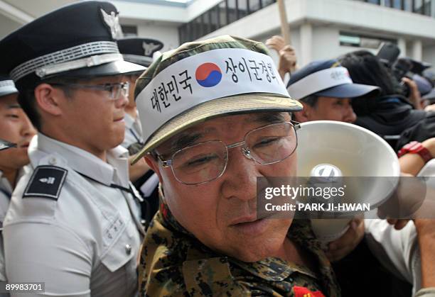 South Korean veterans clash with riot policemen during an anti-North Korea rally while a North Korean condolence delegation arrives at Gimpo airport...