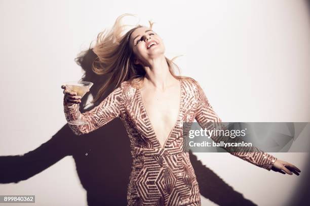 woman dancing in a nightclub - dekolleté stock-fotos und bilder