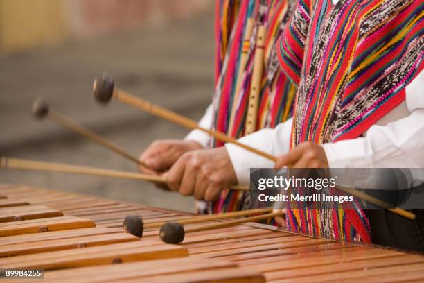 hands of musicians playing marimba. - guatemala stock-fotos und bilder