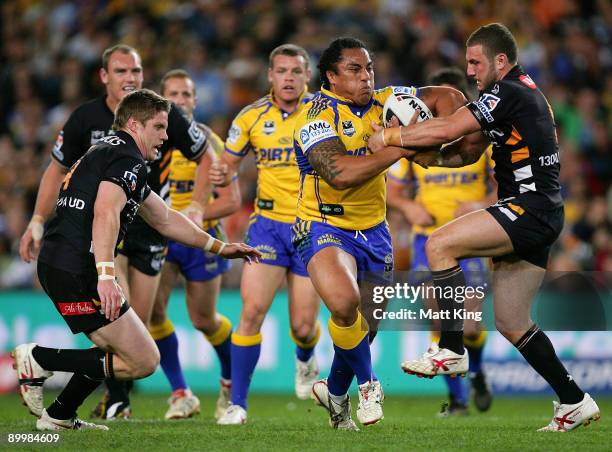 Fuifui Moimoi of the Eels takes on the defence during the round 24 NRL match between the Wests Tigers and the Parramatta Eels at the Sydney Football...