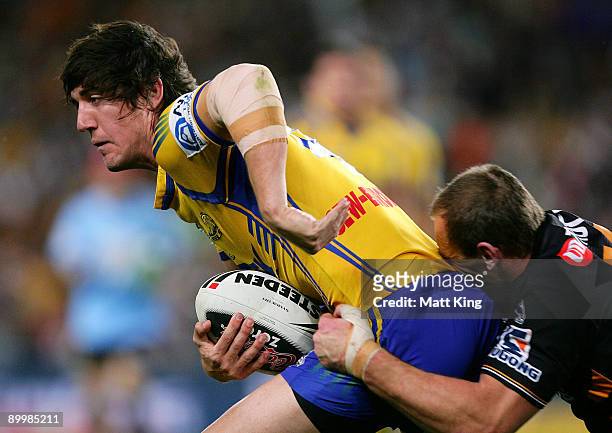 Joel Reddy of the Eels spins out of a tackle during the round 24 NRL match between the Wests Tigers and the Parramatta Eels at the Sydney Football...