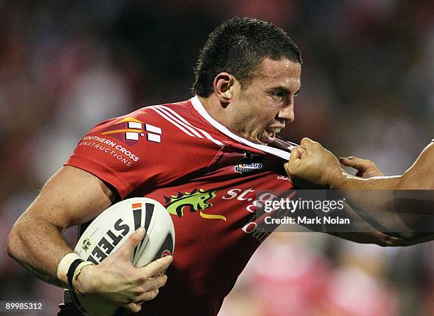 Darius Boyd of the Dragons is tackled by Ben Teo of the Broncos during the round 24 NRL match between the St George Illawarra Dragons and the...