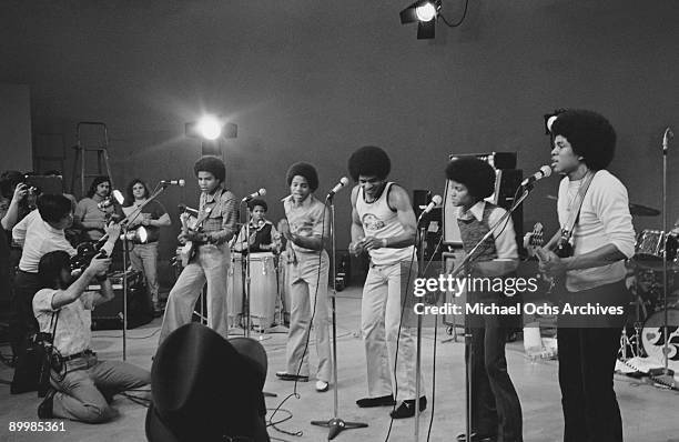 American singer Michael Jackson with the Jackson Five in concert in a television studio, circa 1972. From left to right, Tito, Marlon, Jackie,...