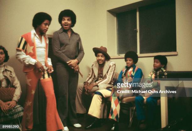 American singer Michael Jackson and his brothers Randy and Marlon backstage at the Inglewood Forum with their father and manager, Joseph Jackson,...