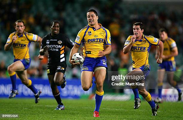 Jarryd Hayne of the Eels makes a break during the round 24 NRL match between the Wests Tigers and the Parramatta Eels at the Sydney Football Stadium...