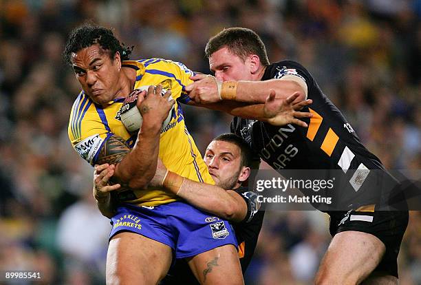 Fuifui Moimoi of the Eels takes on the defence during the round 24 NRL match between the Wests Tigers and the Parramatta Eels at the Sydney Football...