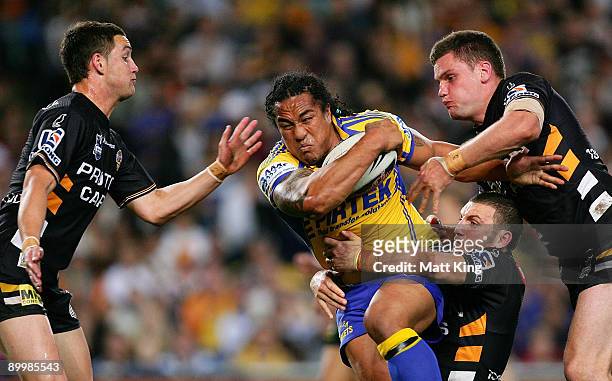 Fuifui Moimoi of the Eels takes on the defence during the round 24 NRL match between the Wests Tigers and the Parramatta Eels at the Sydney Football...