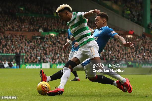 James Tavernier of Rangers vies with Scott Sinclair of Celtic during the Scottish Premier League match between Celtic and Ranger at Celtic Park on...