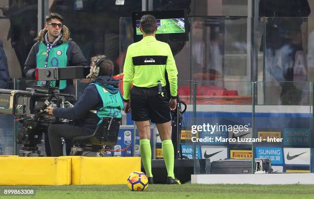 The referee Gianluca Rocchi is checking the VAR during the serie A match between FC Internazionale and SS Lazio at Stadio Giuseppe Meazza on December...