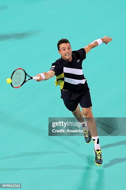 Roberto Bautista Agut of Spain in action during his final match against Kevin Anderson of South Africa on day three of the Mubadala World Tennis...