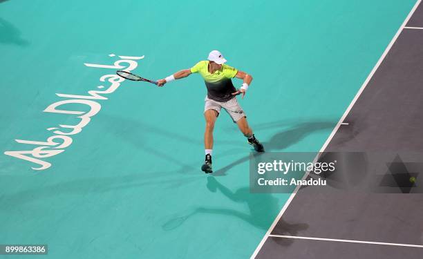 Kevin Anderson of South Africa in action during his final match against Roberto Bautista Agut of Spain on day three of the Mubadala World Tennis...