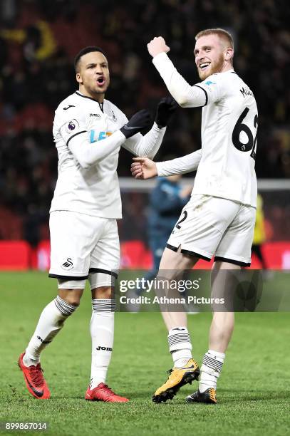 Martin Olsson and Oliver McBurnie of Swansea City celebrate their team's win during the Premier League match between Watford and Swansea City at the...