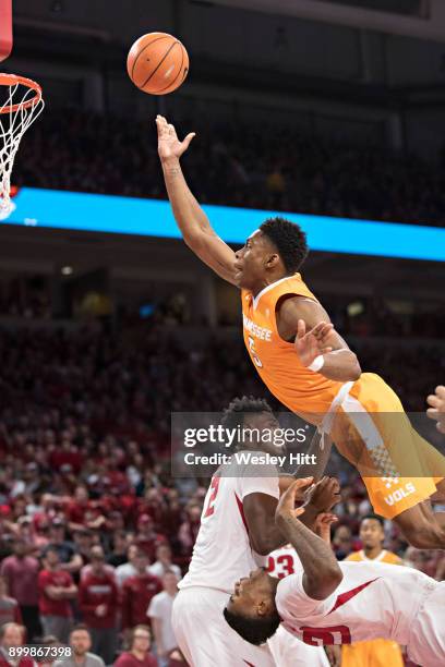 Admiral Schofield of the Tennessee Volunteers goes up for a shot and is called for a charge over Darious Hall of the Arkansas Razorbacks at Bud...