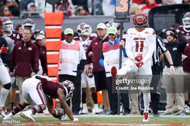 Dee Smith of the Louisville Cardinals reacts after making a tackle for loss in the first half of the TaxSlayer Bowl against the Mississippi State...