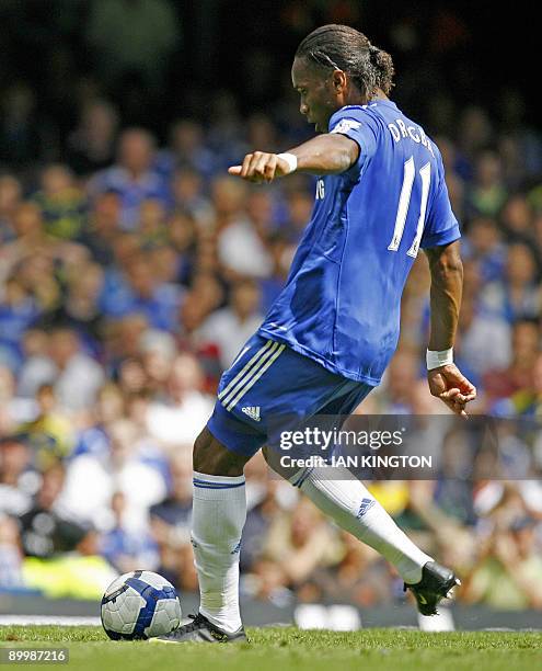 Chelsea's Ivorian striker Didier Drogba scores from a free kick during the Premier League football match between Chelsea and Hull City at Stamford...