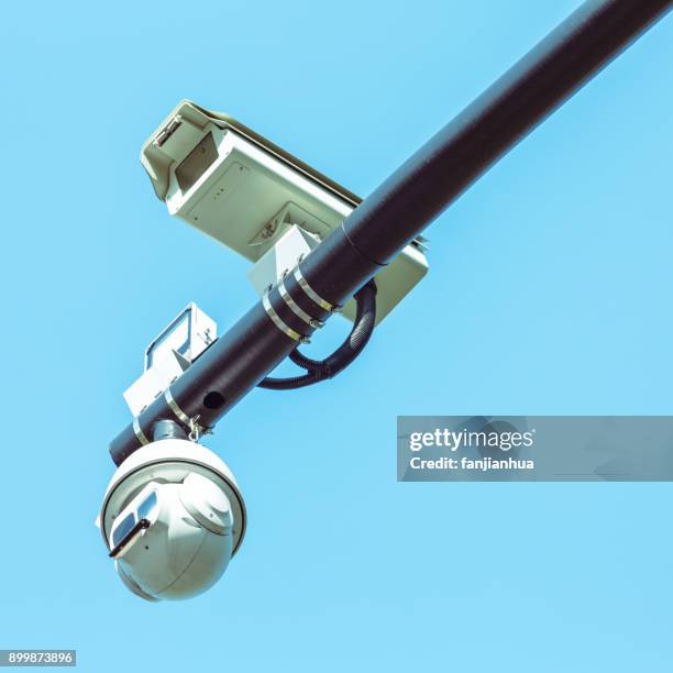 low angle view of security camera against sky - surveillance screen stock pictures, royalty-free photos & images