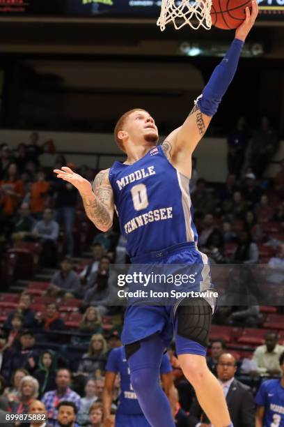 Middle Tennessee Blue Raiders guard Tyrik Dixon goes up for two in the game between the Middle Tennessee Blue Raiders and the Auburn Tigers. Auburn...